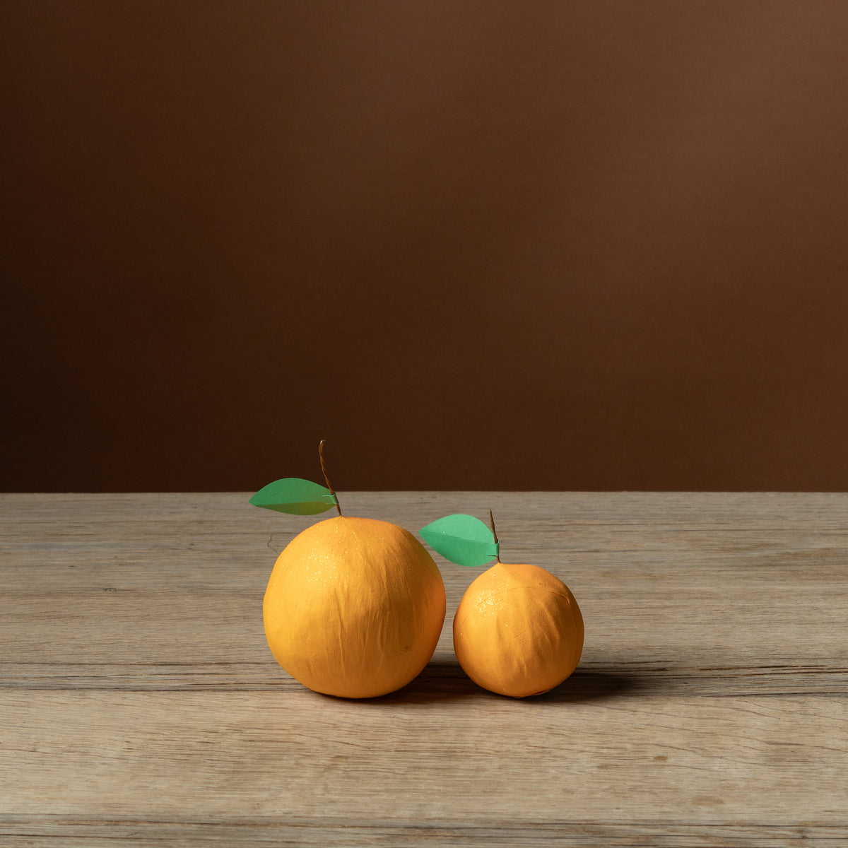 Deluxe and Mini Citrus Surprise Balls side by side for size comparison