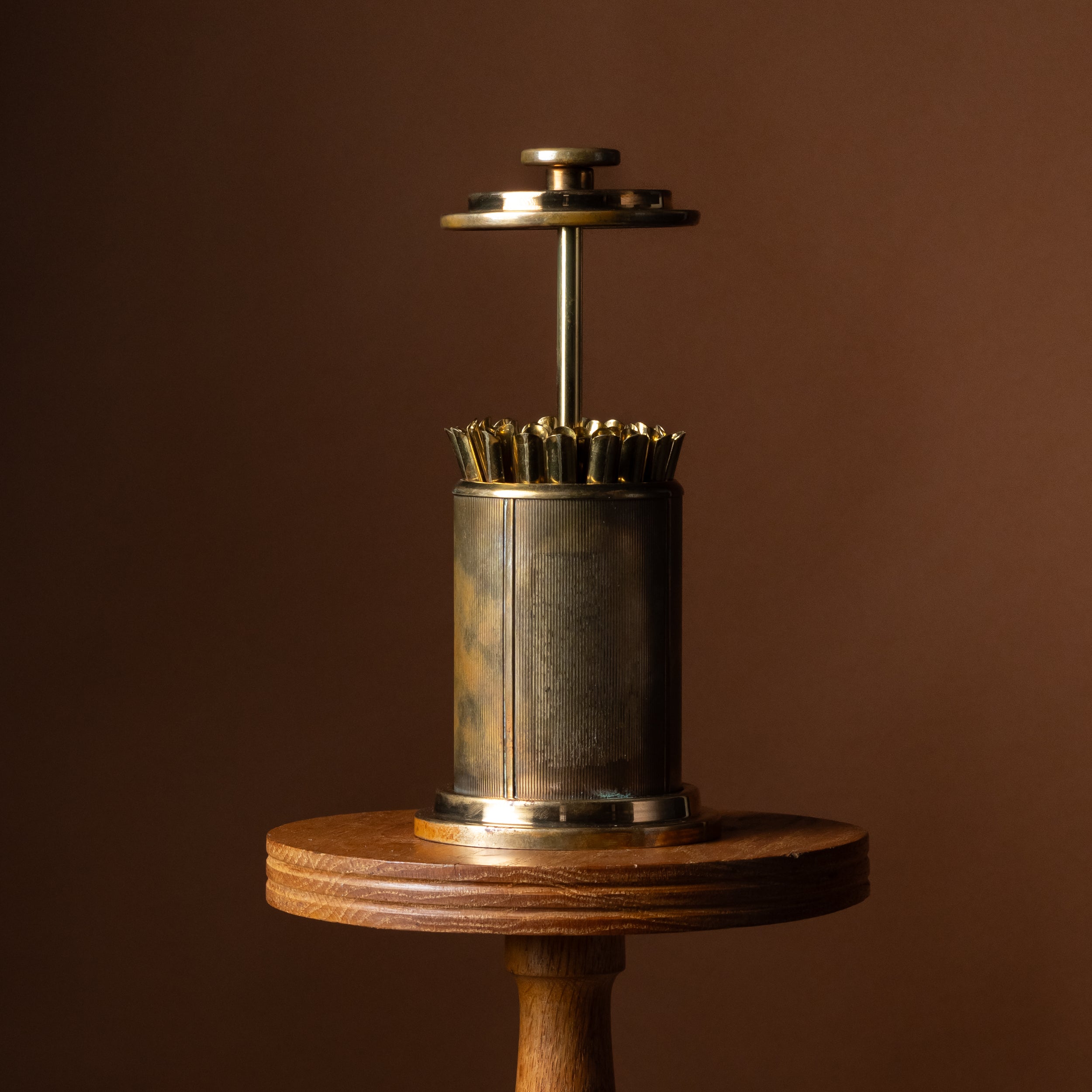 Round Brass Pull-Top Cigarette Dispenser