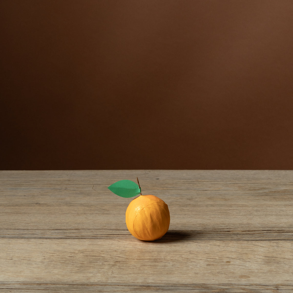 Mini Citrus Surprise Ball, orange crepe paper with green paper leaf